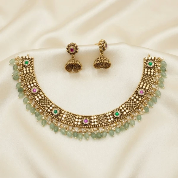 Traditional Gold-Plated Stone-Studded Choker Necklace Set with Jhumka Earrings